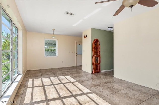 3107 Easy St, Port Charlotte, FL 33952 - unfurnished room with a ceiling fan and baseboards