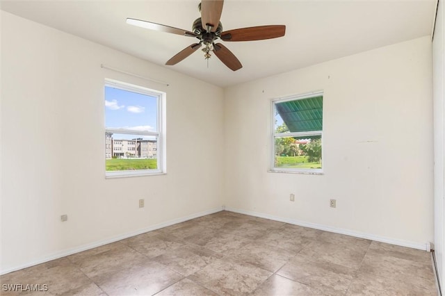 3107 Easy St, Port Charlotte, FL 33952 - spare room with a ceiling fan and baseboards