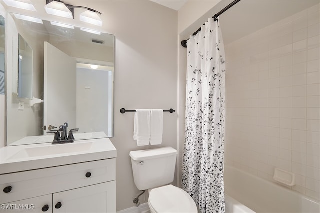 full bathroom featuring vanity, shower / tub combo, and toilet