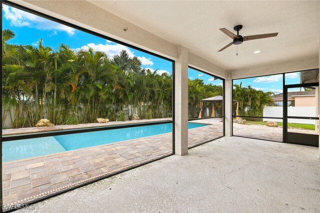 view of pool featuring ceiling fan and a patio