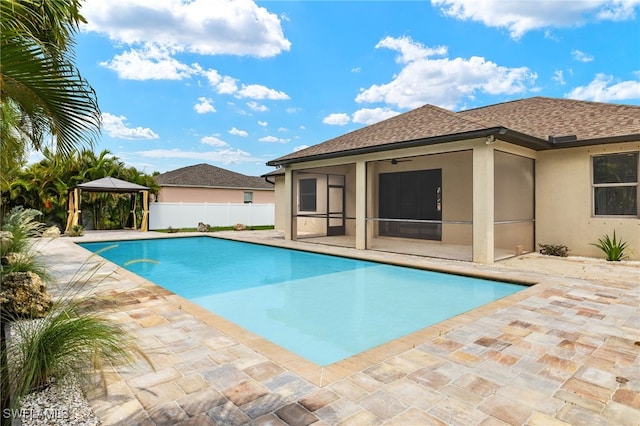 view of pool featuring a gazebo, ceiling fan, and a patio area