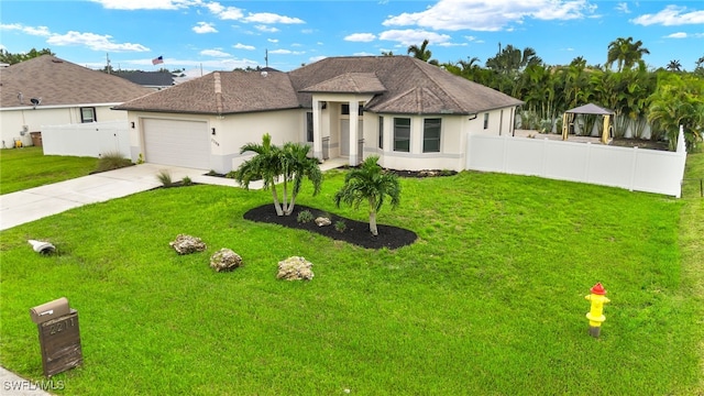 view of front facade featuring a garage and a front lawn