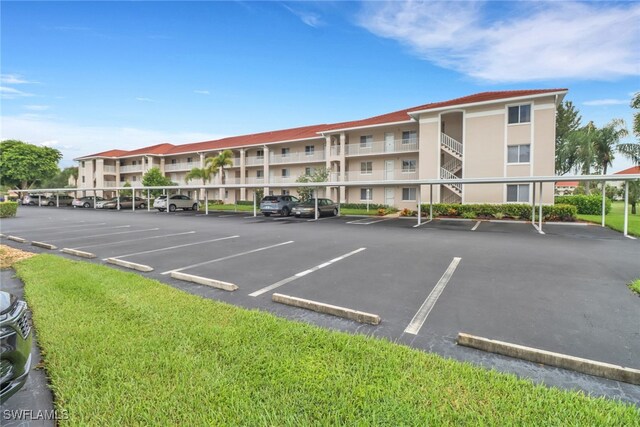 view of vehicle parking with a carport