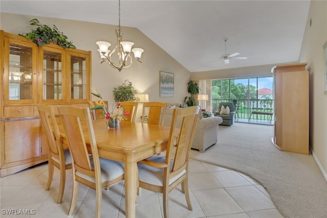 dining room with light carpet, lofted ceiling, and ceiling fan with notable chandelier