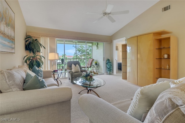 carpeted living room featuring ceiling fan and lofted ceiling