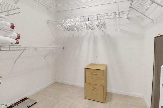 spacious closet featuring light tile patterned flooring