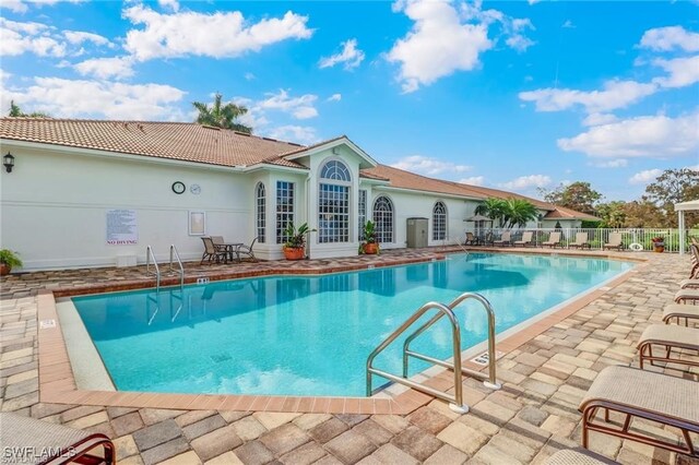 view of swimming pool with a patio area