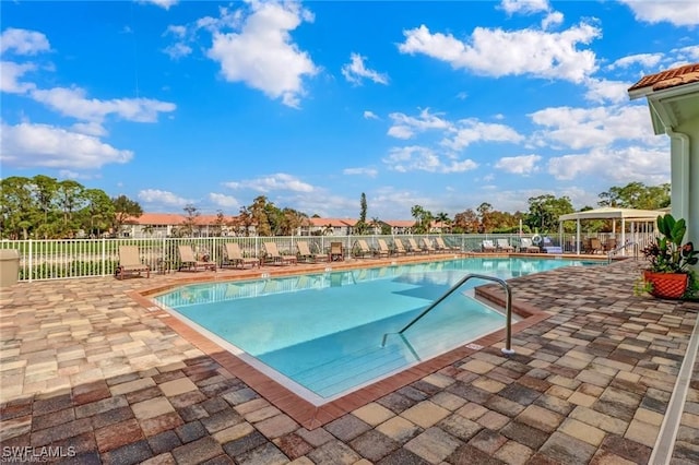 view of swimming pool featuring a patio area