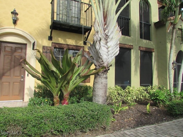 doorway to property featuring a balcony