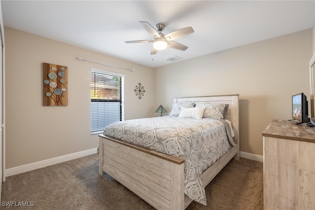 bedroom featuring dark colored carpet and ceiling fan