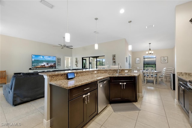 kitchen with light tile patterned floors, dishwasher, a healthy amount of sunlight, and light stone counters