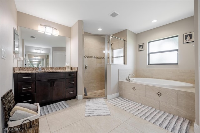 bathroom with vanity, shower with separate bathtub, and tile patterned floors