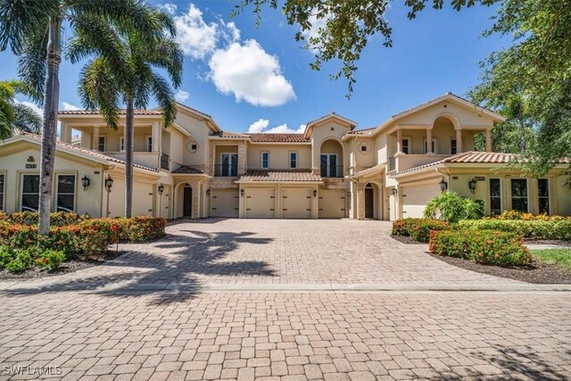 mediterranean / spanish-style home featuring a garage