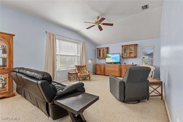 living room featuring light carpet, lofted ceiling, and ceiling fan