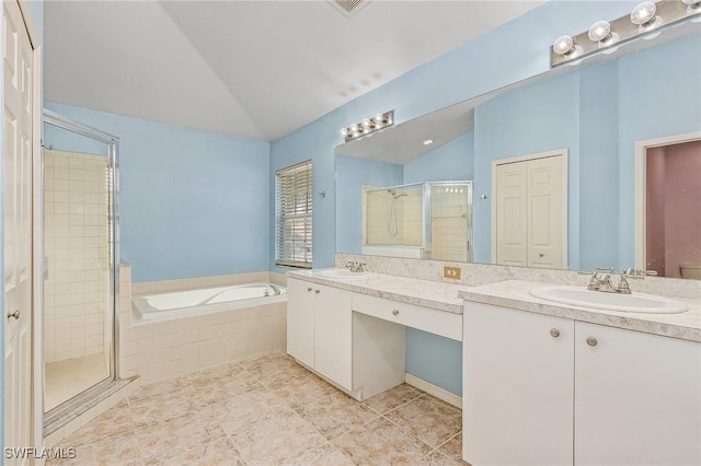 bathroom with double sink vanity, shower with separate bathtub, tile patterned floors, and lofted ceiling