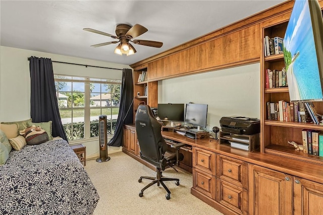 interior space featuring ceiling fan and light colored carpet