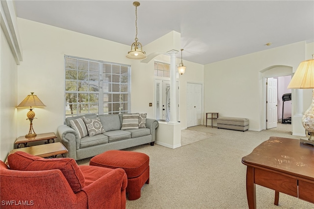 living room featuring light carpet and ornate columns