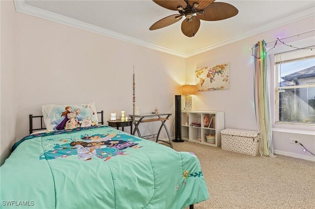 carpeted bedroom featuring ceiling fan and crown molding