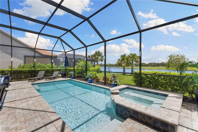 view of swimming pool with an in ground hot tub, a patio area, and glass enclosure