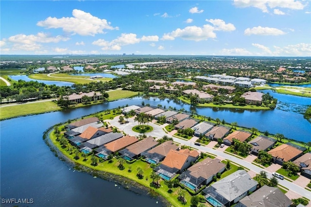 drone / aerial view with a residential view and a water view