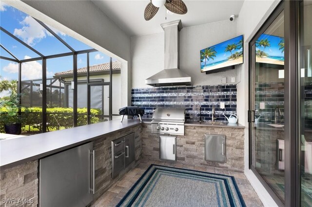 view of patio / terrace featuring an outdoor kitchen and a grill