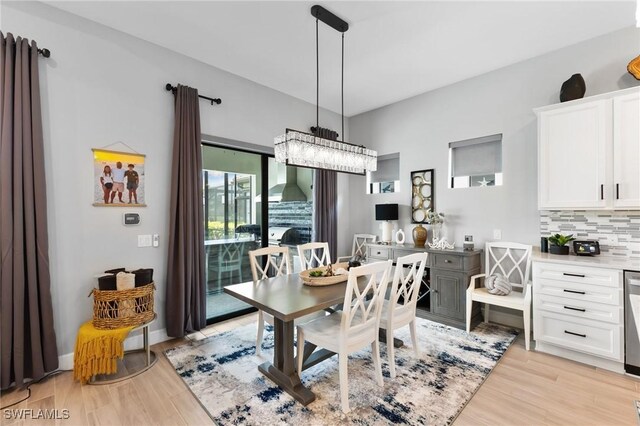 dining space with light hardwood / wood-style floors