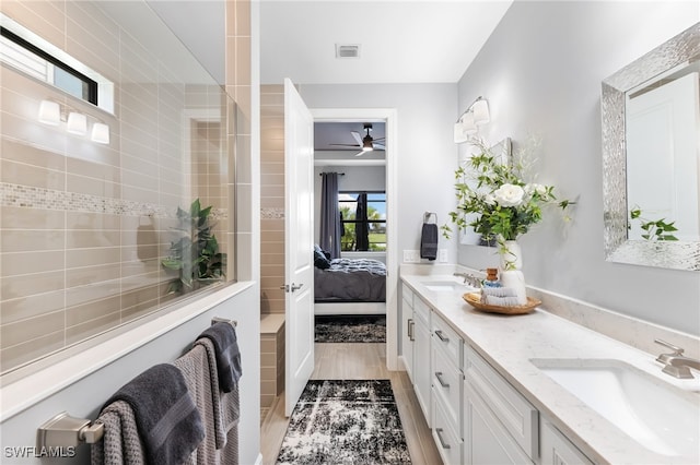 bathroom with vanity and hardwood / wood-style flooring