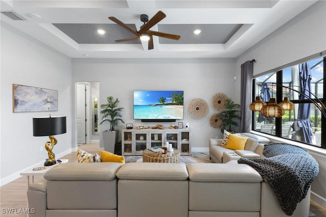 living room featuring ceiling fan and light hardwood / wood-style floors