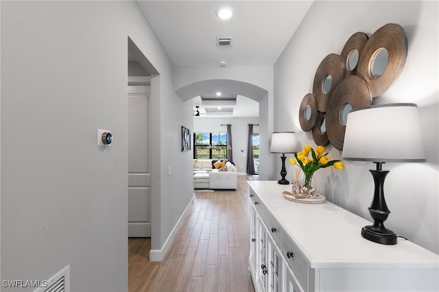 2740 Amaranda Ct, Naples, FL 34114 - hallway with arched walkways, visible vents, recessed lighting, and light wood-type flooring