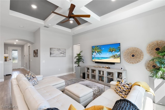 2740 Amaranda Ct, Naples, FL 34114 - living room featuring visible vents, light wood finished floors, ceiling fan, arched walkways, and coffered ceiling