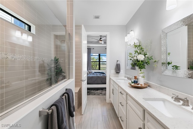 2740 Amaranda Ct, Naples, FL 34114 - bathroom featuring double vanity, ensuite bath, ceiling fan, and a sink
