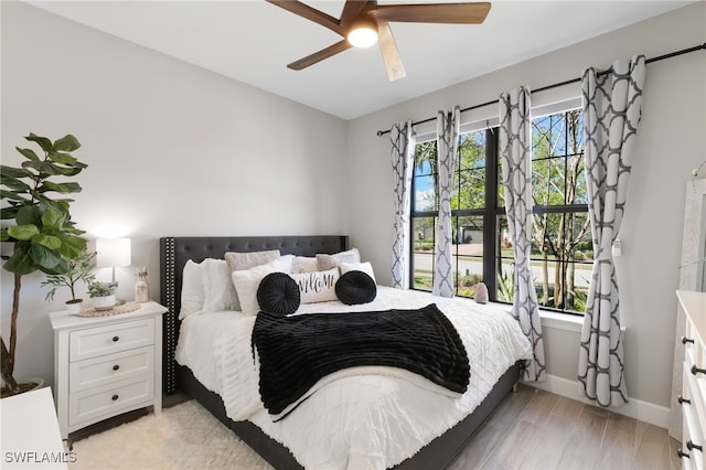 2740 Amaranda Ct, Naples, FL 34114 - bedroom featuring baseboards, ceiling fan, multiple windows, and light wood finished floors