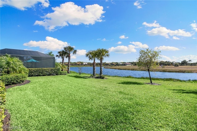 2740 Amaranda Ct, Naples, FL 34114 - view of yard with glass enclosure and a water view