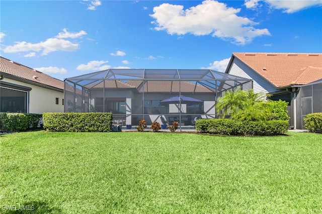 2740 Amaranda Ct, Naples, FL 34114 - rear view of property with a tile roof, glass enclosure, and a yard