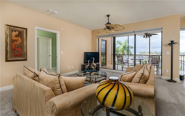 carpeted living room with ceiling fan