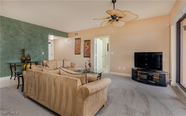 living room with ceiling fan and light colored carpet