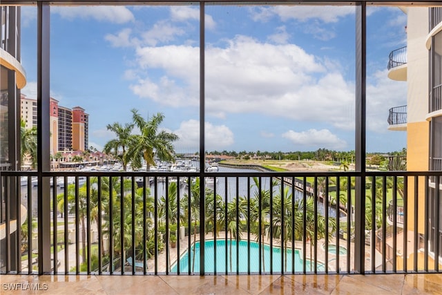 balcony with a fenced in pool