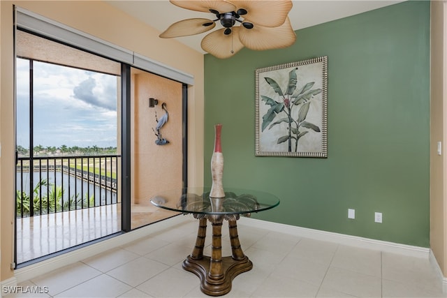 entryway featuring ceiling fan, a healthy amount of sunlight, and light tile patterned floors