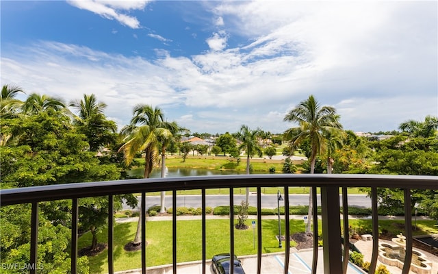 balcony featuring a water view