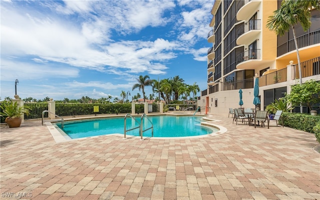 view of swimming pool with a patio