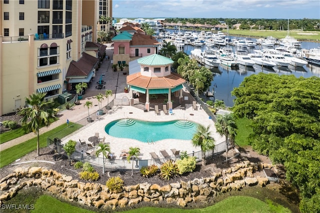 view of swimming pool featuring a gazebo, a water view, and a patio area