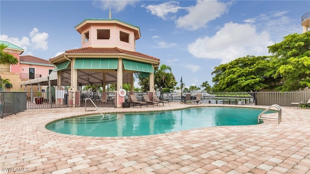 view of swimming pool featuring a gazebo and a patio