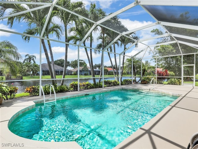 view of pool with a patio area and a lanai