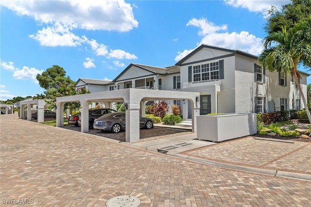 view of front of property with a carport