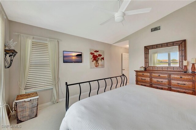 carpeted bedroom with lofted ceiling and ceiling fan