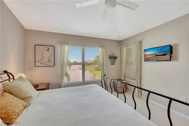 bedroom featuring ceiling fan and carpet floors