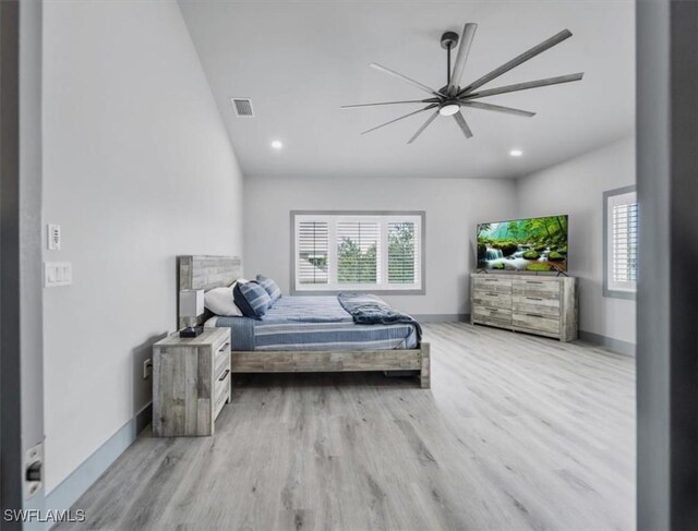 bedroom with light hardwood / wood-style flooring and ceiling fan