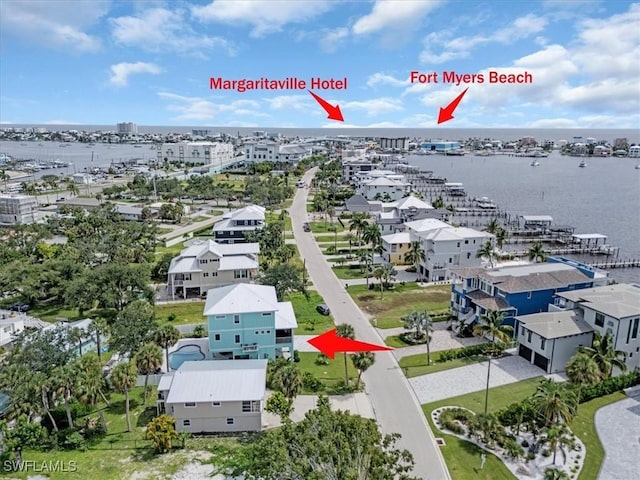 aerial view with a water view and a residential view