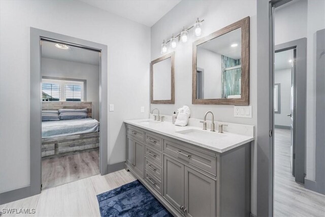 bathroom featuring vanity and wood-type flooring