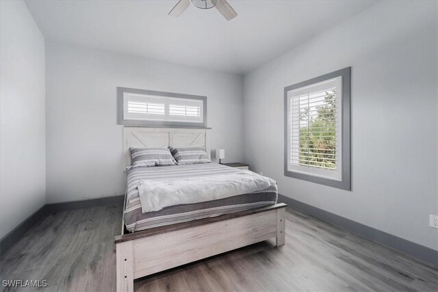 bedroom featuring hardwood / wood-style flooring and ceiling fan